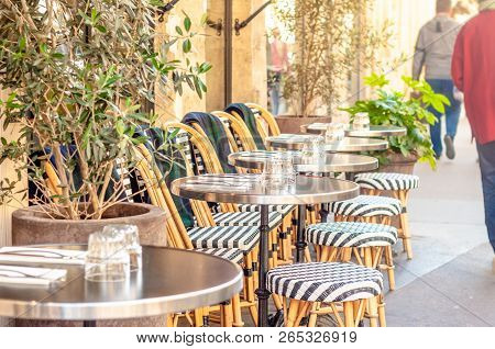 Street Scene In Paris With Cafeshop Tables