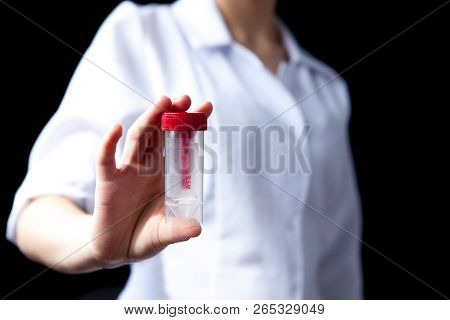 Close Of Woman Hands Holding Sterile Sample Container Bottle For Medical Analysis. Health Care And M
