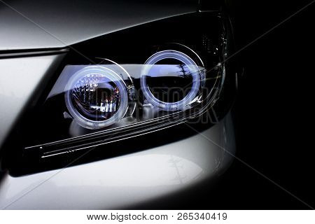 Car Headlights Of Silver Color Dark Tone Is Aggressive And Gorgeous.