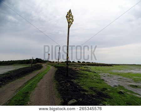 A Landscape View Of A Causeway Across A Estuary Leading To Northey Island In Essex At Low Tide With 