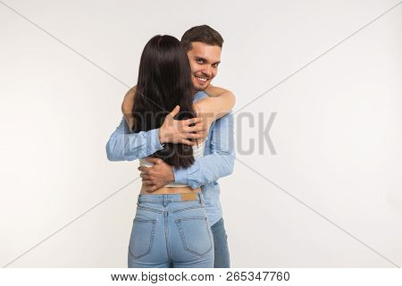 Handsome Man Hugging His Girlfriend On White Background