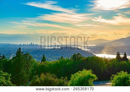 Aerial view of Burnaby Mountain at sunset overlooking Vancouver Harbour and the Burrard inlet in British Columbia, Canada.