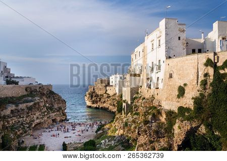Monopoli, Italy - July 6 2018: People On Lovely Beach Lama Monachile In Polignano A Mare, Adriatic S