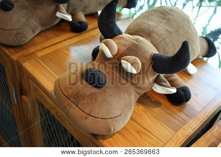Sleeping Brown Buffalo Doll, Peace Calm Bull With Black Horn On Wooden Table, Background