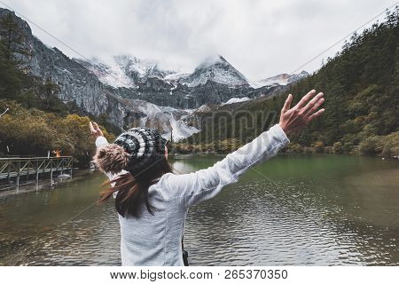 Hiking Young Woman Traveler Looking Beautiful Landscape And Refreshing At Yading Nature Reserve, Tra