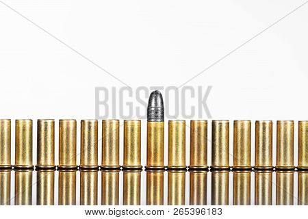Series Of Cartridges Or Ammunition Against White Background, Concepts Such As Business Or Arms Expor