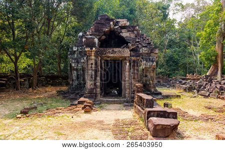 Ancient Ruins Of An Abandoned Temple Of Prasat Krol Ko In The Jungle At Angkor Wat Complex, Siem Rea