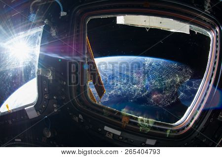 Collage Image With Huge La City At Night With City Lights From The Outer Space From The Iss Window. 