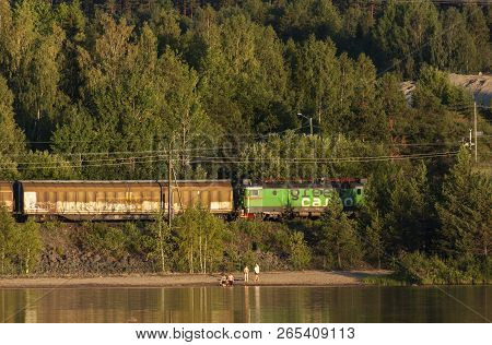 Medelpad, Sweden On July 05. View Of A Lake, A Small Beach This Side A Railway On July 05, 2018 In M