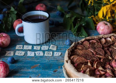 Apple Pie On Wooden Blue Rustic Background. Hello Autumn Picture. Apples, Tea In A Metal Countre Cup