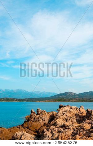 a view of the rock formations in La Tonnara, on the Southern coast of Corsica,  France, with the calm Mediterranean sea in the background