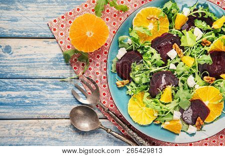 Fresh Salsd With Beetroot, Orange And Arugula. Vitamin Rich And Healthy Food. Light Nutrition For Ho