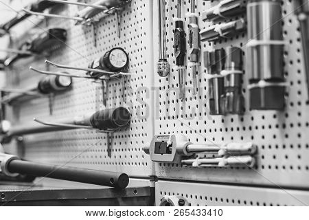 Electric Tools For Construction On The Stand In The Shop