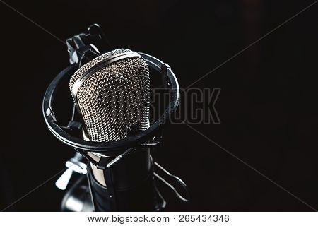 Professional Studio Condenser Microphone On Black Background