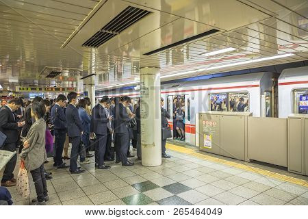Tokyo, Japan - April 17, 2017: Rush Hour: Crowd Of People Waiting The Marunouchi Line, Subway Line I
