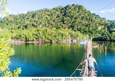 Boca De Miel, Cuba - Feb 4, 2016: Hanging Bridge Over Rio Miel River Near Baracoa, Cuba