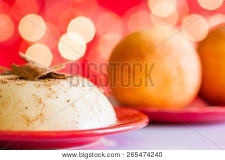 Traditional Colombian Bunuelos (deep Fried Cheese Bread) And Natilla On Christmas Red Background