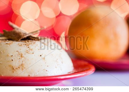 Traditional Colombian Bunuelos (deep Fried Cheese Bread) And Natilla On Christmas Red Background