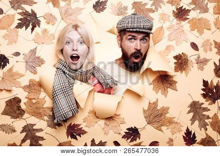 Happy Couple, Bearded Man And Blond Woman In Yellow Background With Leaves. Autumn Couple Wearing In
