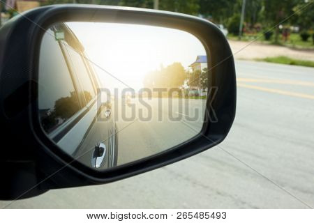 Car Stop On The Road View On Mirror With Light.