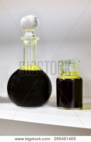 The Glass Flasks With Raw Vegetable Oil.
