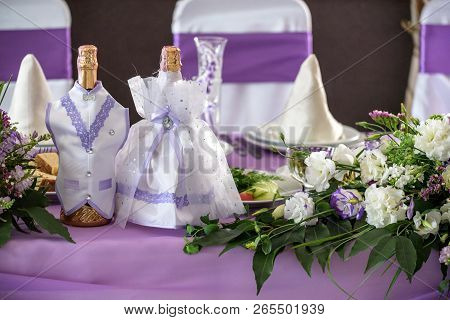 Wedding. Banquet. The Chairs And Round Table For Guests, Served With Cutlery, Flowers And Crockery A