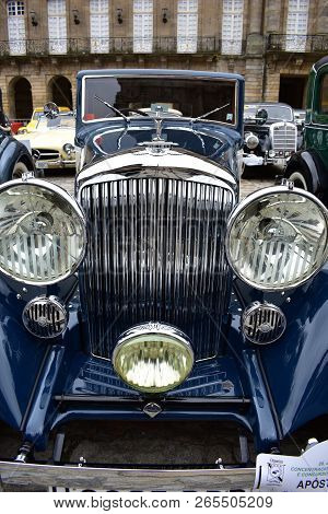 Blue shiny classic car in public exhibition close to Cathedral. Obradoiro Square, Santiago de Compostela 2018.