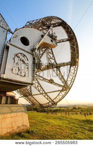 Satellite Dish In A Summer Landscape, Sky Background.