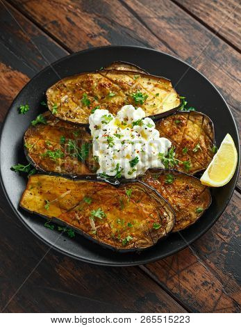 Healthy Vegeterain Oven Baked Aubergines, Eggplant With Cottage Cheese Dip, Parsley And Lemon Wedge.