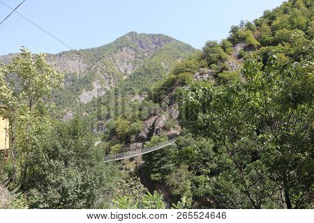 Suspension Bridge Over A Mountain Stream In The Ismailly Region