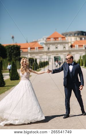 Groom Dance With Bride In The Pakr Near The Palace In Wiena, Austria