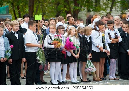 Tyumen, Russia - September 1, 2012: School 43. School Line Is In Schoolyard With Pupils And Teachers
