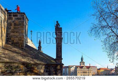 Prague, Czech Republic - December 1, 2012:  Tourists And Statues Of The Charles Bridge On The Moldav