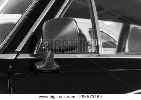 Monochrome Background - Rearview Mirror And Door Fragment Of A Vintage Black Car