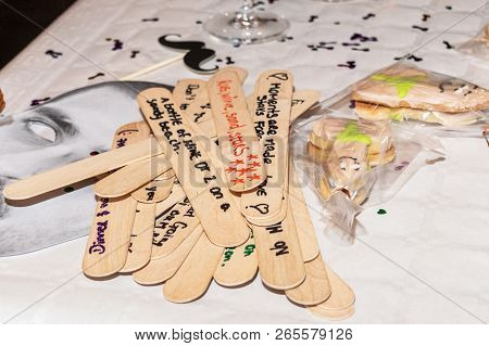 Date Night Jar Messages On Wood. Text At A Hens Party For The Bride. Horizontal. Side View. Shallow 