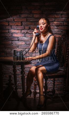 Beautiful Pinup Woman Gossiping On The Phone