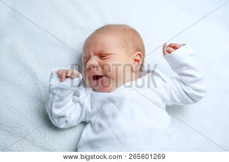 Crying Newborn Baby Boy Or Girl On Changing Table