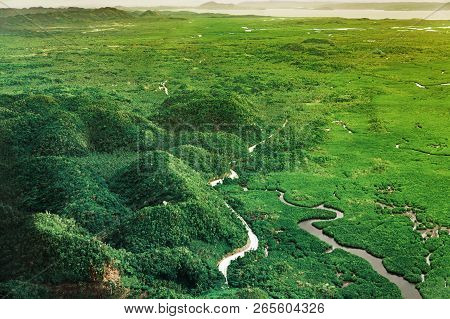 Aerial View On The Beautiful Sunset Above Mountains And Green Mangrove Tropical Forest In Siargao Is