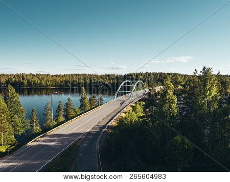 Steel Bridge Over Lake At Suomussalmi Finland On A Sunny Evening