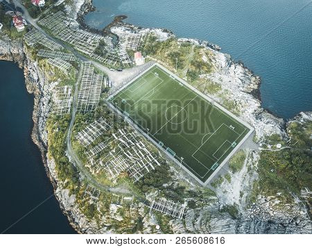 Football Field Stadium In Henningsvaer From Above. Henningsvaer Is A Fishing Village Near Reine And 