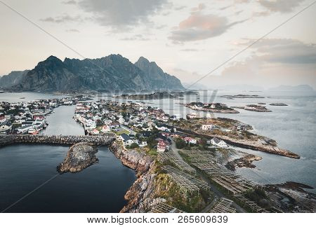 Aerial View Of Henningsvaer, Its Scenic Football Field And Mountains In The Background. Henningsvaer