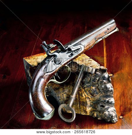 Flintlock Pistol And Jailers Key.