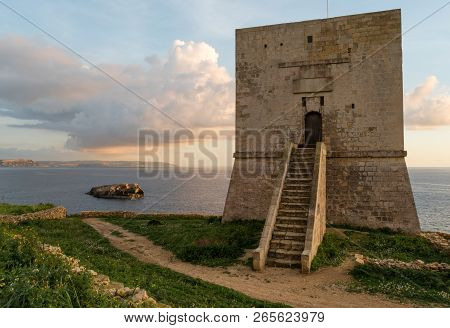 Mgarr Ix-xini Bay Tower Gozo. Malta. Horizontal At Sunset