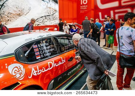 Paris, France - Oct 4, 2018: Adult Customers Curious People Admiring New Sport Rally Citroen C2 Wrc 