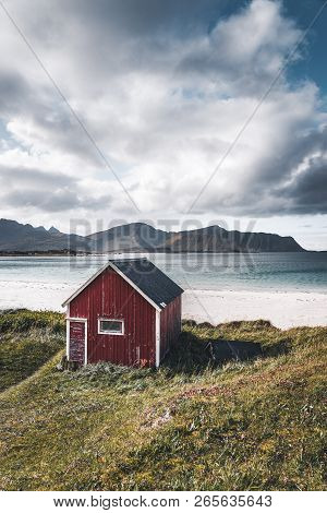 A Typical House Of The Fishermen Called Rorbu On The Beach Frames The Sea At Ramberg Lofoten Islands