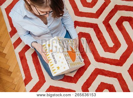 Paris, France - Jan 5, 2018: Overhead View From Above Of Curious Fashionable Woman Opening The Cardb