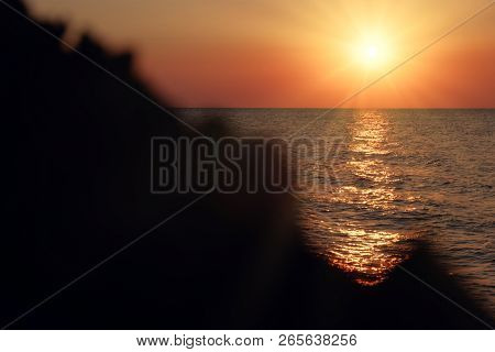 Sea Sunset View From Cliff With A Lot Of Copyspace On Dark Rock