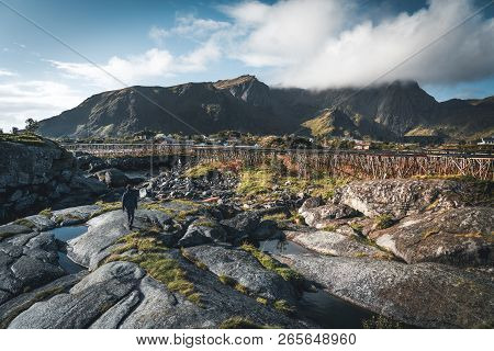 Rainbow Ofer Red Houses Rorbuer Of Reine In Lofoten, Norway With Red Rorbu Houses, Clouds, Rainy Blu