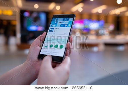 Chiang Mai, Thailand - August 03,2018: Woman Holding Huawei Mobile Phone With Linkedin Application O