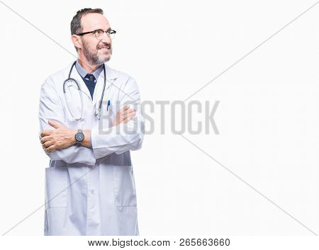 Middle age senior hoary doctor man wearing medical uniform isolated background smiling looking side and staring away thinking.